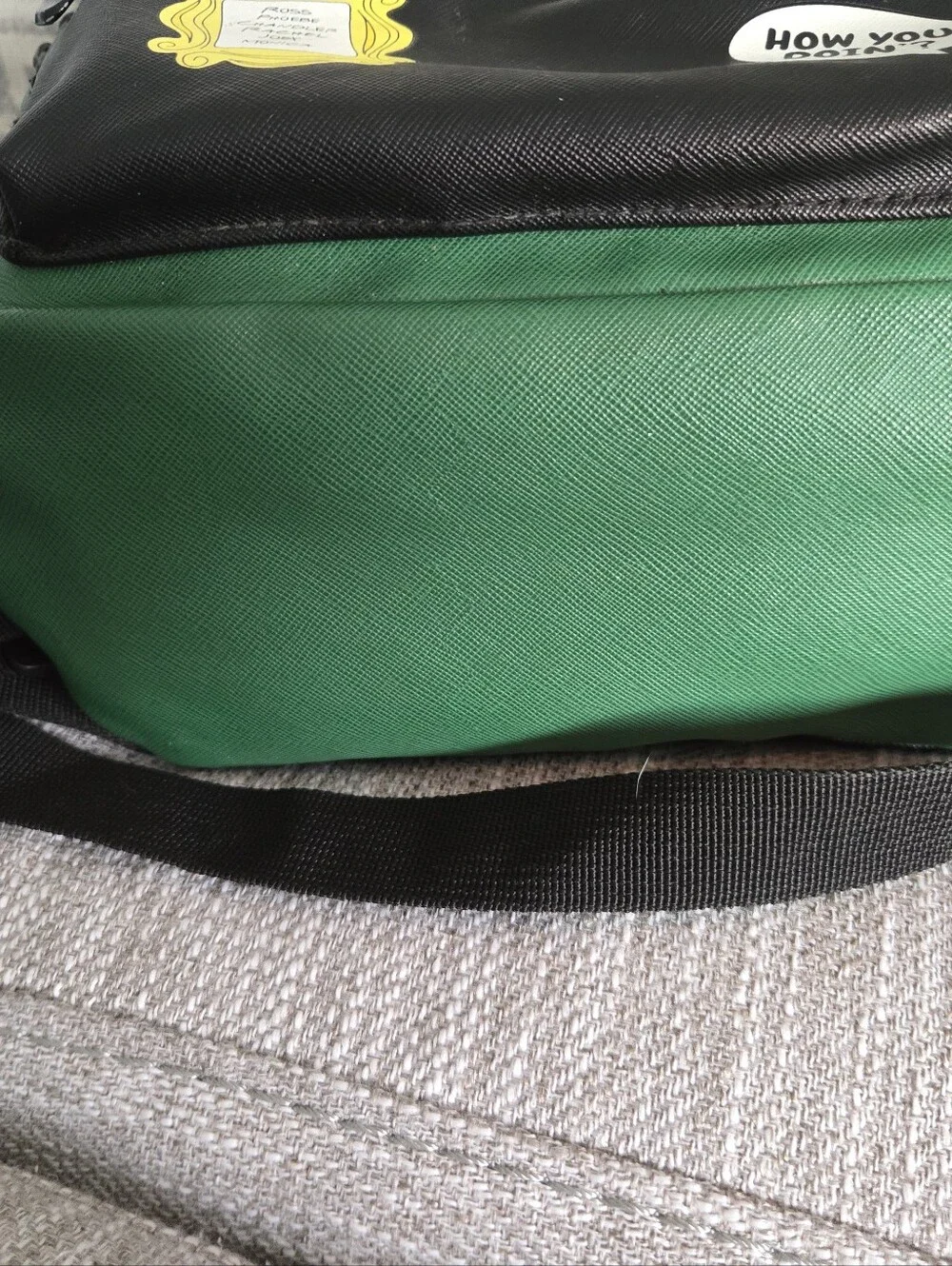 This green and black Friends Central Perk faux leather mini backpack